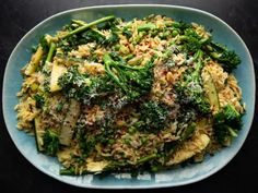 a blue plate topped with rice and broccoli