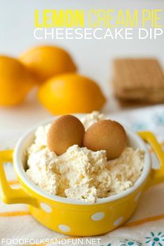 lemon cream pie cheesecake dip in a yellow bowl