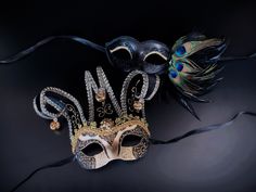 This couple's Masquerade Mask pairing complements any Mardi Gras themed attire. Gold, purple and green vibrant colors to complete your Mardi Gras look no matter what you wear!  I N C L U D E D Available as a couple's set.   Masks come with matching double sided satin ribbons attached. S H I P P I N G  -   Processed same day or within 24 hours.  1-2 day guaranteed delivery services offered, add items to cart and click on shipping tab for rates.  Pls leave a check out note with your need date & co Mardi Gras Masks And Prosthetics, Black Masquerade Mask For Carnival, Black Masquerade Mask For Festivals And Costume Party, Black Masquerade Mask For Party Festivals, Black Masquerade Mask For Party And Festivals, Black Masks For Masquerade Festivals, Black Masquerade Mask For Festivals, Black Masks For Costume Festivals, Black Costume Masks For Festivals