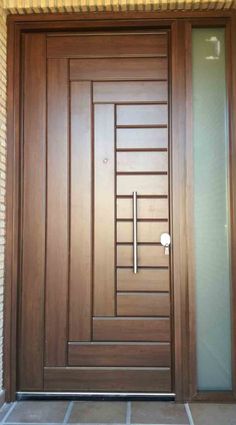 a modern wooden door with glass panels