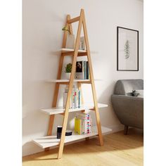 a wooden ladder leaning against a white wall in a living room next to a couch