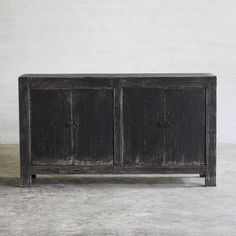 an old wooden cabinet with two doors