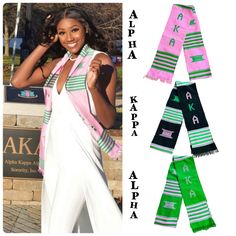 a woman wearing pink and green scarfs in front of a sign with letters on it