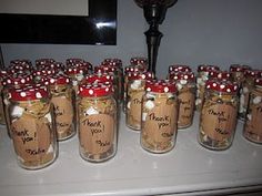 there are many mason jars with red and white polka dots on them, all labeled thank you