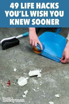 a person is cleaning the floor with a blue bucket and brush on top of it