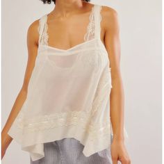 Free People Morning Call Tunic Intimates - Size Small, Nwt Draped To Perfection, This Swingy Tunic Is Featured In The Breeziest Fabrication With A Straight Neckline, Ribbon And Lace Trim, And A Billowing Handkerchief Hem. Relaxed, Hip Length Bust: 35 In Length: 16.5 In Delicate Summer Camisole Top, Delicate Camisole Tops For Summer, Feminine White Camisole With Lace Patchwork, White Feminine Camisole With Lace Patchwork, Delicate White Summer Tops, Delicate White Tops For Summer, Delicate Lace Summer Tops, Delicate Summer Daywear Camisole, Delicate White Sleeveless Top