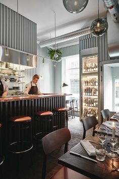 a man is behind the bar at a restaurant