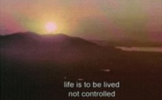 the sun is setting over mountains with a quote written on it that reads, life is to be lived not controlled