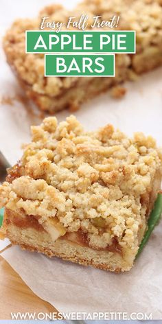 two pieces of apple pie bar sitting on top of paper