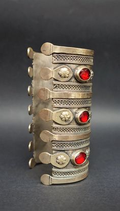 "Welcome! Kuchi Ethnic Cuff Bracelet . Stones cornaline in red and weight: 0,230 gr Material: the silver metal is a mix between silver, brass bronze they used to call \"gillet\" This is a great antique piece. In good condition! Measures: - Total Long: 4.72\" (12 cm) x W 2.55\" (6,5 cm) x 1.57\" (4 cm) open diameter Thanks for stopping by!!I" Traditional Silver Jeweled Bracelets, Red Bangle Cuff Bracelet For Festival, Red Bracelets For Festivals, Vintage Adjustable Jewelry, Red Heavy Bracelets For Festivals, Silver Jeweled Bangle For Ceremonial Occasions, Heavy Adjustable Vintage Jewelry, Red Bohemian Jewelry For Ceremonial Occasions, Vintage Red Bracelets For Festival