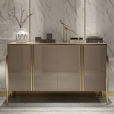 a white and gold sideboard in a room