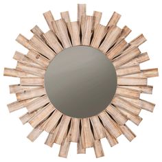 a round mirror made out of wood sticks