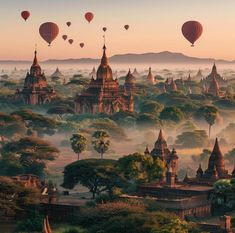 hot air balloons flying over the temples in bagan