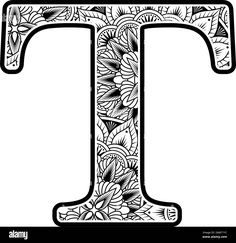 the letter t decorated with flowers and leaves