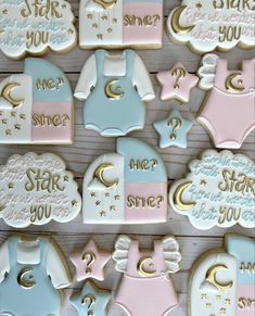 baby shower cookies are arranged on a table