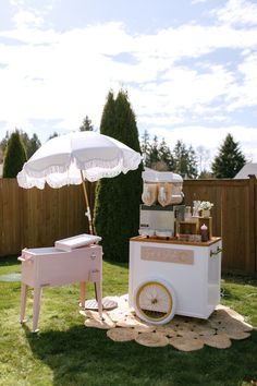 an ice cream cart is set up in the yard