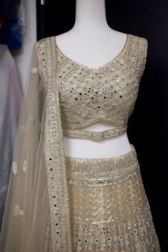 *Fully mirror embellished lehenga set  *Ready made  *Size Bust: 36, 38 inches available - please message us for customization options *Color may vary slightly from picture  *Our store is located in Los Angeles & in store pick up is welcome Gold Palazzo Set With Dori Work For Party, Fitted Bollywood Style Sharara With Mirror Work, Designer Fitted Choli With Mirror Work, Sequined Fitted Lehenga In Chinon, Bollywood Style Sequined Lehenga In Chinon, Fitted Sequined Choli In Chinon, Fitted Chinon Choli With Sequins, Fitted Sequin Chinon Lehenga, Fitted Sequined Chinon Choli