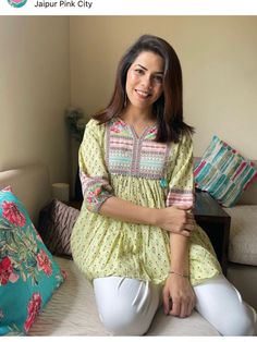 Jaipuri print Indian ethnic cotton print summer top in green and pink with a lovely empire cut top , beautiful medley of colors make it perfect for the summer and everyday wear . Pair it with denims or linens , it will be your go to comfort wear