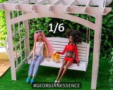 two dolls sitting on a bench in the grass