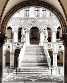 an arched doorway with stairs leading up to it