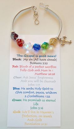 a bracelet with beads and charms on it sitting next to a card that says, the good is good news