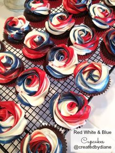 red, white and blue cupcakes on a cooling rack