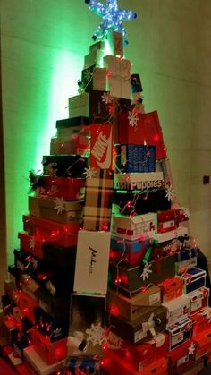 a christmas tree made out of boxes and presents