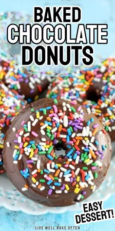 there are chocolate donuts with sprinkles on the plate and text overlay reads baked chocolate donuts easy dessert