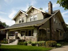 a large house with two story windows on the front