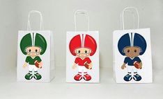 three small bags with cartoon characters on them, one is holding a baseball glove and the other has a football