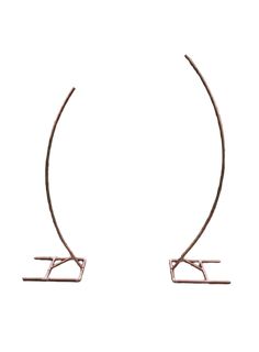 a pair of metal hoop earrings with long curved ends, on a white background photo