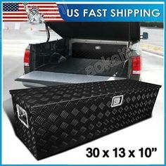 the truck bed cover is black and has an american flag on it