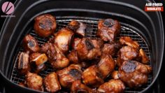 the meat is being cooked in an air fryer