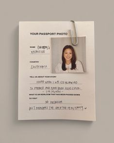 a passport photo attached to a clipboard