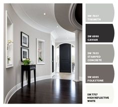 an image of a room with white walls and wood flooring in shades of gray