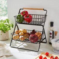 two baskets filled with vegetables on top of a counter