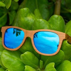 The Sunset Classic with Blue lens is inspired by the deep blue. With a lightweight design that floats on water this pair is sure to be your go-to sunglasses for all your beach days in Waikiki. The sunglasses feature an engraved tribal design on each arm and natural finished wood to promote durability. Product Details: Made from Cherry Wood Blue Mirror Polarized Lens UVA/UVB Protection Eco friendly sunglasses Unisex style Blue Wayfarer Sunglasses With Mirrored Lenses, Blue Sunglasses With Tinted Lenses For Outdoor Activities, Trendy Blue Sunglasses For Outdoor Activities, Outdoor Blue Polarized Sunglasses, Blue Polarized Sunglasses For Outdoor, Wayfarer Sunglasses With Mirrored Lenses For Vacation, Wayfarer Sunglasses With Uv Protection For Beach, Beach Wayfarer Sunglasses With Mirrored Lenses, Uv Protection Wayfarer Sunglasses For Beach