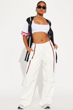 Available In Black/White And Cream/combo. Jogger Pant Elastic Waistband High Rise Drawstring Hand Pockets Cargo Pocket Stripe Stretch Wide Leg Adjustable Toggler Hem 30" Inseam Main Fabric: 100% Polyester Imported | Street Vibe Wide Leg Jogger Pant in Cream size Large by Fashion Nova White Cargo Pants With Elastic Waistband For Streetwear, High Waist White Cargo Pants For Streetwear, White High Waist Cargo Pants For Streetwear, Sporty White Wide Leg Cargo Pants, Sporty White Cargo Pants With Elastic Waistband, White Stretch High Waist Cargo Pants, Sporty White Cotton Cargo Pants, White Cargo Pants With Elastic Waistband, Mexico Outfits