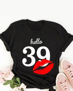 a black shirt with red lips and the words hello 79 on it