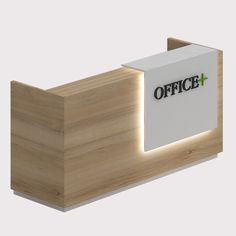 an office reception desk with the word office lit up on it's front wall