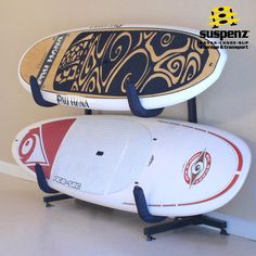 two surfboards are stacked on top of each other