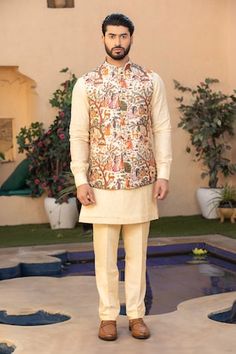 Cream silk bundi with all over village pichwai art print. Paired with an inner lucknowi embroidered kurta and pant. - Aza Fashions Designer Nehru Jacket With Printed Motifs For Festivals, Festival Nehru Jacket With Printed Motifs, Diwali Printed Chanderi Nehru Jacket, Diwali Chanderi Nehru Jacket With Printed Motifs, Diwali Nehru Jacket With Printed Motifs In Chanderi, Festive Nehru Jacket With Printed Motifs, Cotton Nehru Jacket With Printed Motifs For Festivals, Nehru Jacket With Printed Motifs For Festivals, Designer Raw Silk Nehru Jacket For Festivals