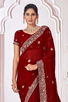 Embrace elegance with this stunning Georgette saree, designed to make every festival feel extraordinary. Crafted from lightweight Georgette fabric, the saree drapes effortlessly, offering a blend of comfort and style. The blouse, also in matching Georgette, complements the saree’s flowing texture, making it a harmonious ensemble. Delicate border work adds a refined charm, elevating the saree with a hint of traditional appeal. Ideal for festive occasions, it captures the essence of timeless beauty and modern grace.Please Note: Colors may vary slightly due to digital imaging. Accessories shown are for display purposes only. Border Work Saree, Saree Drapes, Digital Imaging, Maroon Color, Timeless Beauty