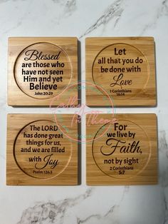 four wooden coasters with bible verses on them