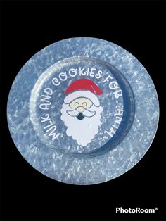 a glass plate with a santa claus face on it's side and words around the edge