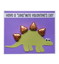 a dinosaur valentine's day card with chocolate candies