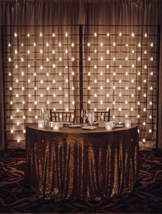 the table is set up with candles and place settings for two people to sit at