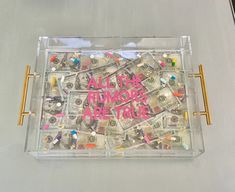 a tray that has money in it with the words all the money are rich written on it