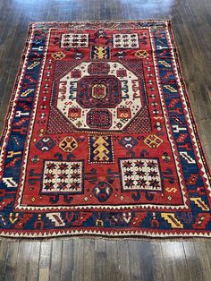 This rug is handmade in the caucasus mountains.Known as Karachov Kazak. Karachov sits in the south-western caucasus close to the border with Armenia and Turkey.With its large ivory central octagon it is flanked at the four corners of the field by ivory squares containing small nine-pointed stars, which is typical for this group of rugs. This Karachov kazak has a wonderful and powerful presence with plenty of space in the magnificent red field as well as in the beautiful blue border, certainly one of the best Karachov exist in the market. There are expert restorations in the rug, otherwise in very good condition. The wool used to make this rug is of high quality and dyed with all organic elements. Caucasus Mountains, Blue Border, Caucasian Rug, Antique Persian Rug, Four Corners, Armenia, Distressed Rugs, Rug Pillow, The Four