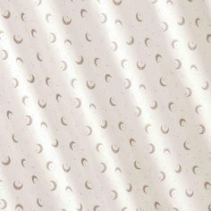 an image of a white and beige background with crescents